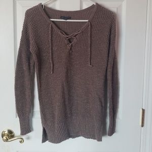 Weave knit sweater with shoelace tie neckline